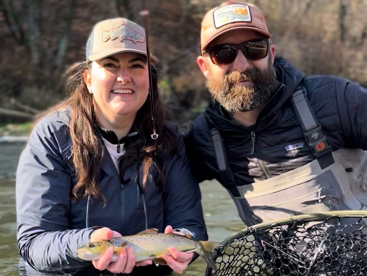 Image of a client and Bret with a fish they caught