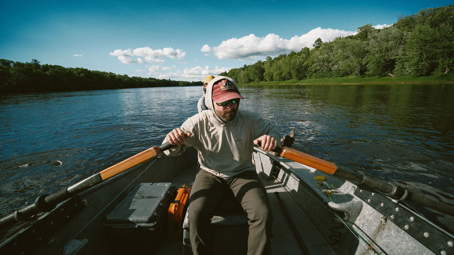 Image of Bret rowing a boat with a client