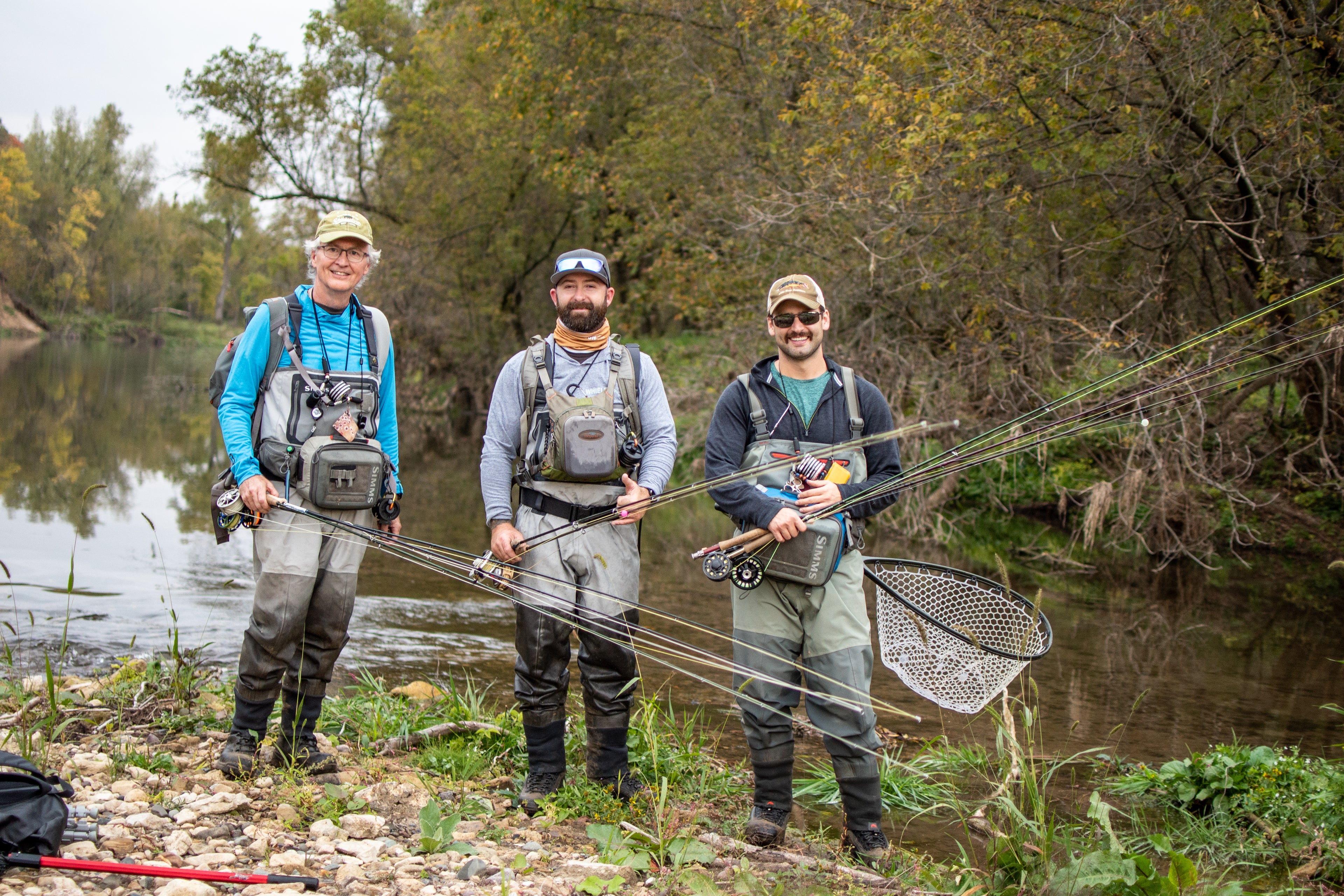 Image of Bret with 2 clients and their fly rods